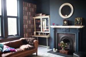 A living room with dark walls