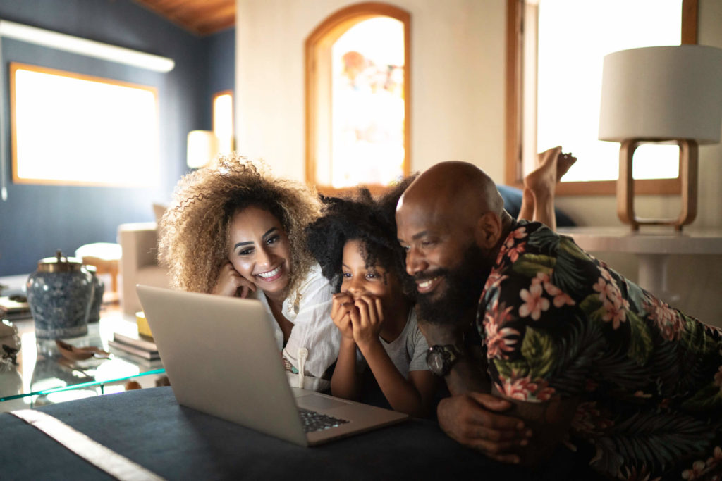 Family streaming content on laptop