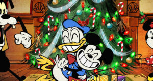 Mickey Mouse and Donald Duck in front of a Christmas tree