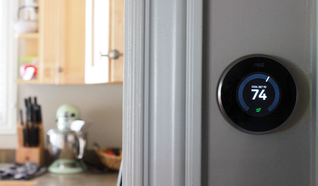 Nest Learning Thermostat on wall in home