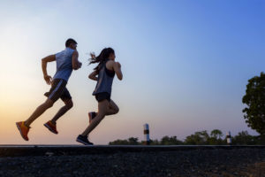 Fitbit Versa 2 Smartwatch Review | couple running at sunset