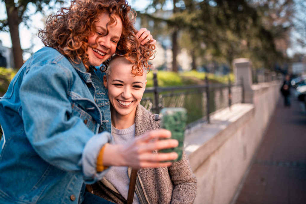 Two people taking a selfie together in a park