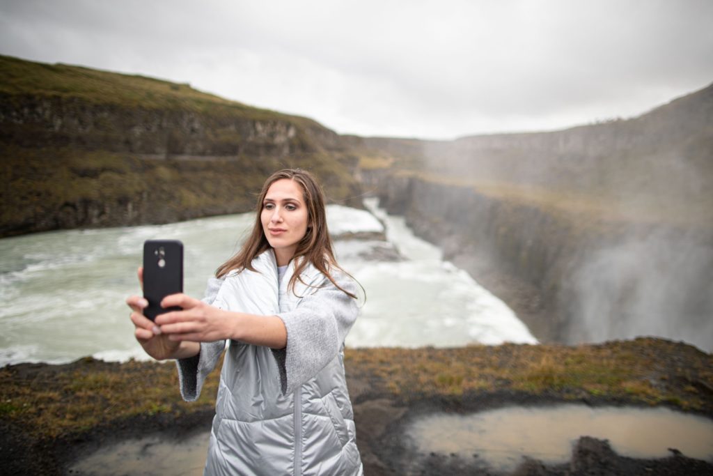 Woman taking a picture with her phone
