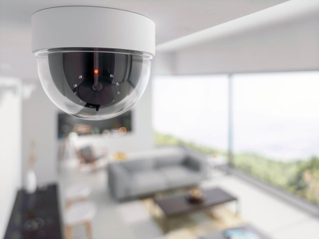 Dome security camera on the ceiling of a living room