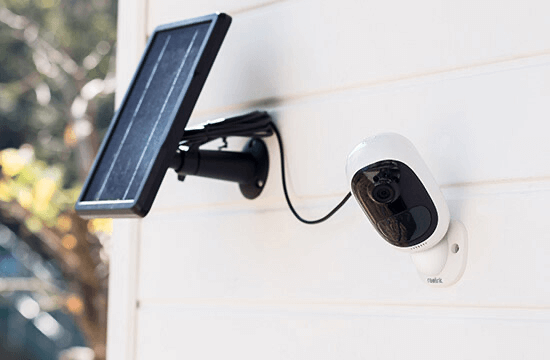 Argus 2 mounted on a wall with a solar panel