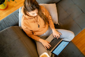 Young woman working from home on laptop