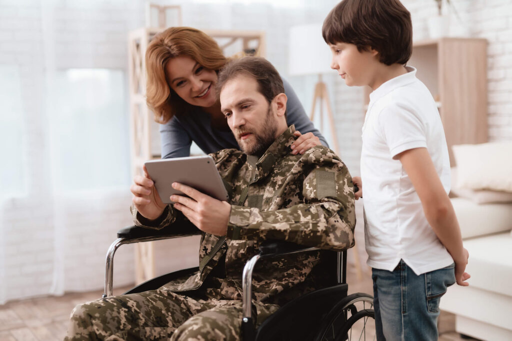Veteran and family using tablet