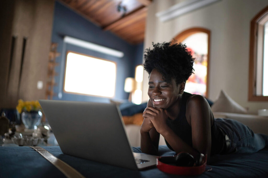 Woman watches videos on laptop