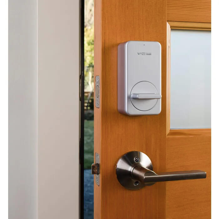Wyze Lock installed on a partially open brown door