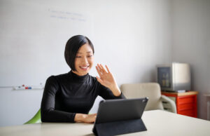 Woman takes video call on tablet