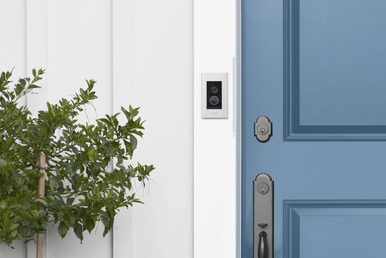 Ring Video Doorbell Elite installed next to a blue front door