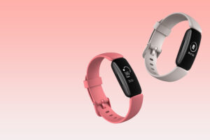 two fitbits on pink backgroun