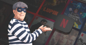 Photo of a man in a burglar costume in front of Netflix