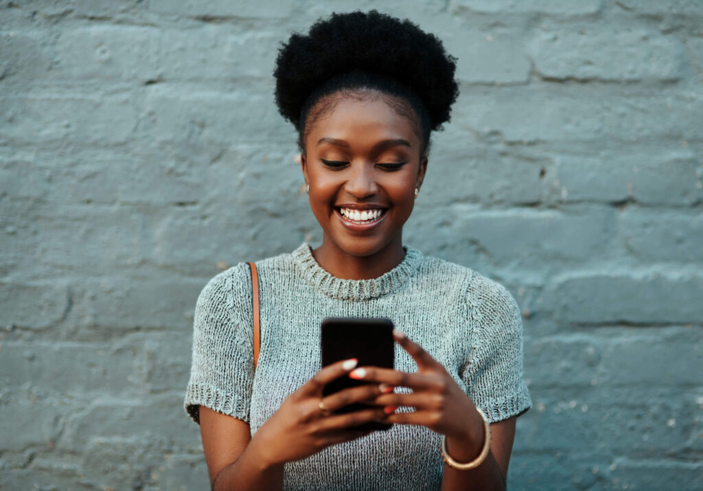 Woman Using Phone On The Street