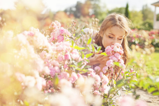 Woman smelling flowers