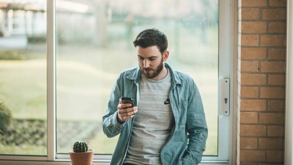 Man looking at smartphone