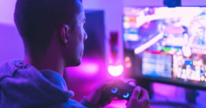 Photograph of a man playing online games