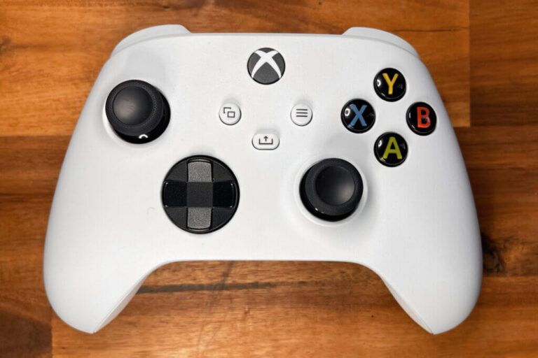 A close up of a white Xbox Series S controller