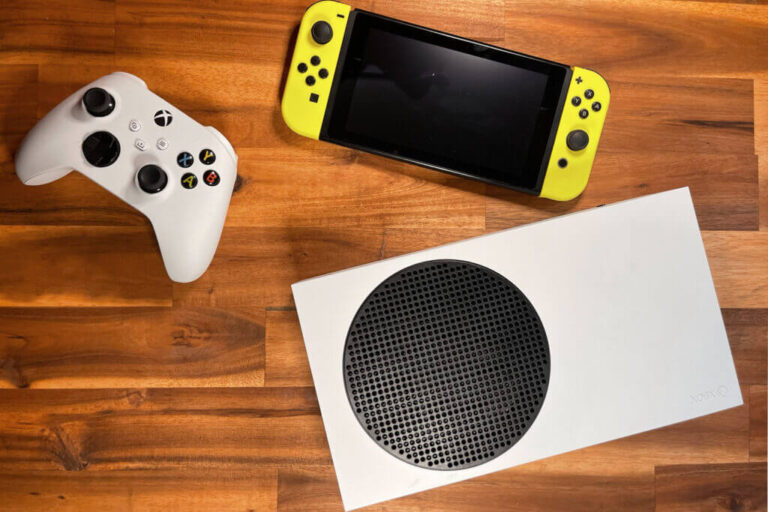 A white Xbox Series S console and controller next to a yellow Nintendo Switch