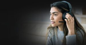 Photograph of young woman using wireless Xbox headset