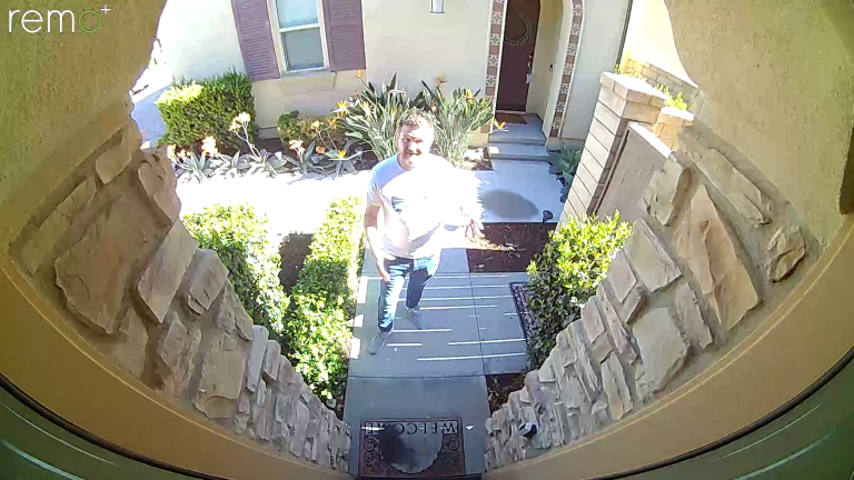 Photo of Steve outside on the doorstep looking at the Remo+ Doorcam 2