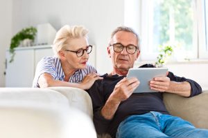 Older adults viewing camera feed on tablet