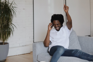 happy man calling someone on an unlocked Optus phone