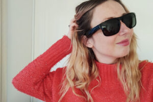 Blonde woman in a red jumper wearing Bose Frames Tenor