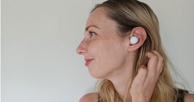 Photograph of editor wearing the Google Pixel Buds A-series