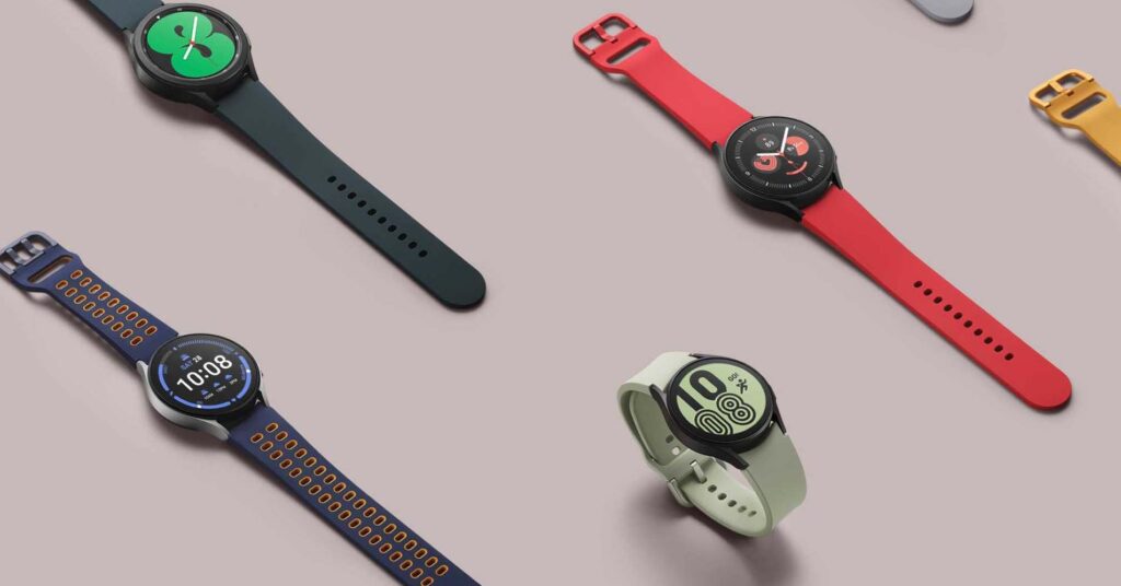 Samsung Galaxy Watch 4 in four different colours on a light pink background