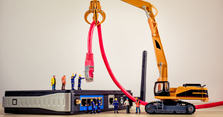 Image of toy men connecting a modem with a crane
