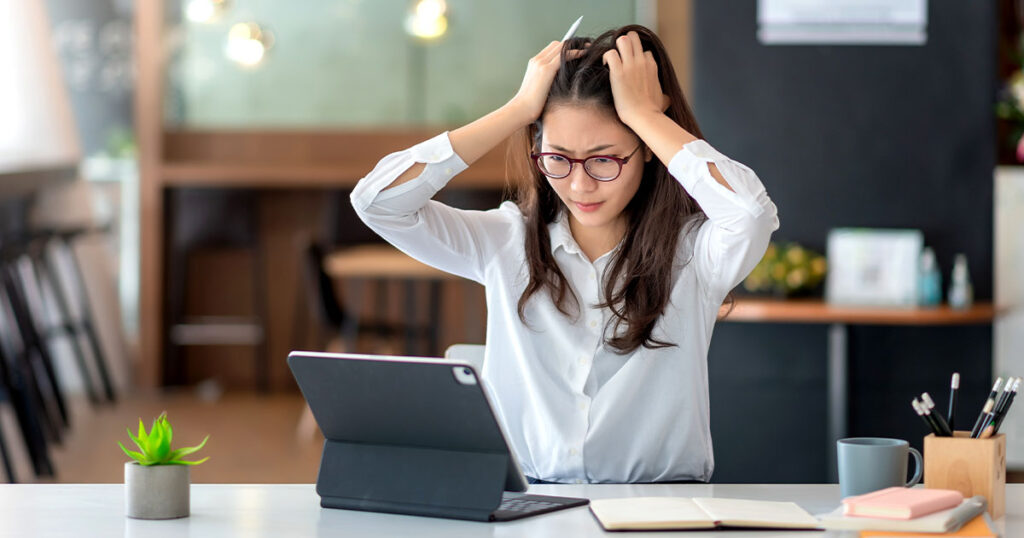 Stock photograph of a woman having NBN internet issues