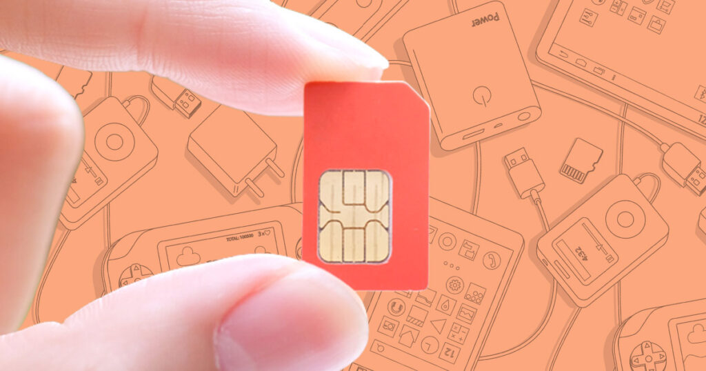 Image of a hand holding a red SIM card
