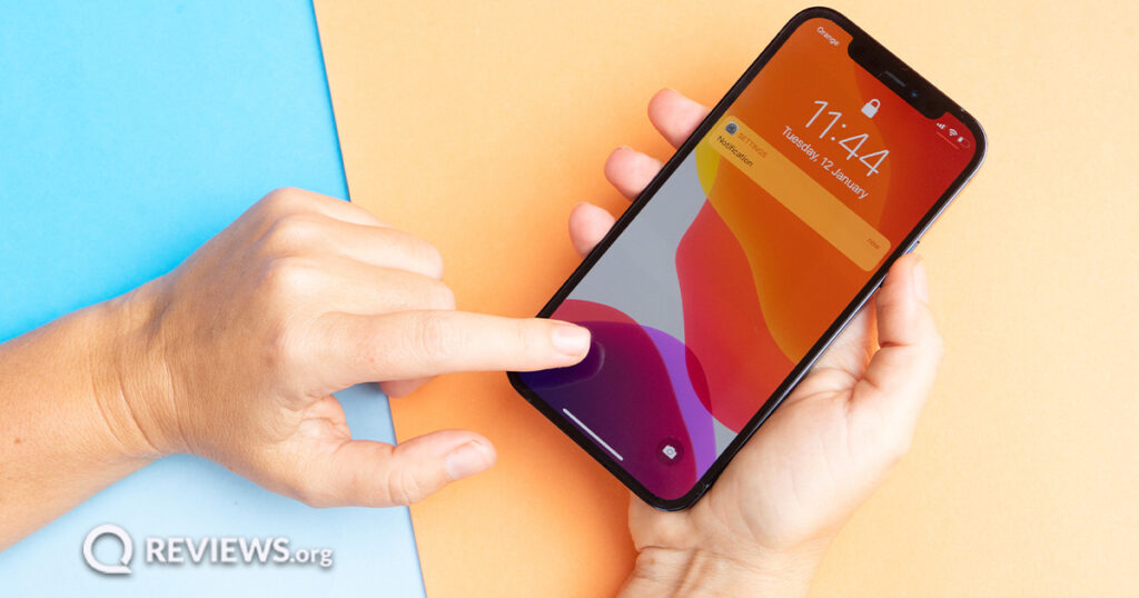 Photograph of someone entering Apple ID password