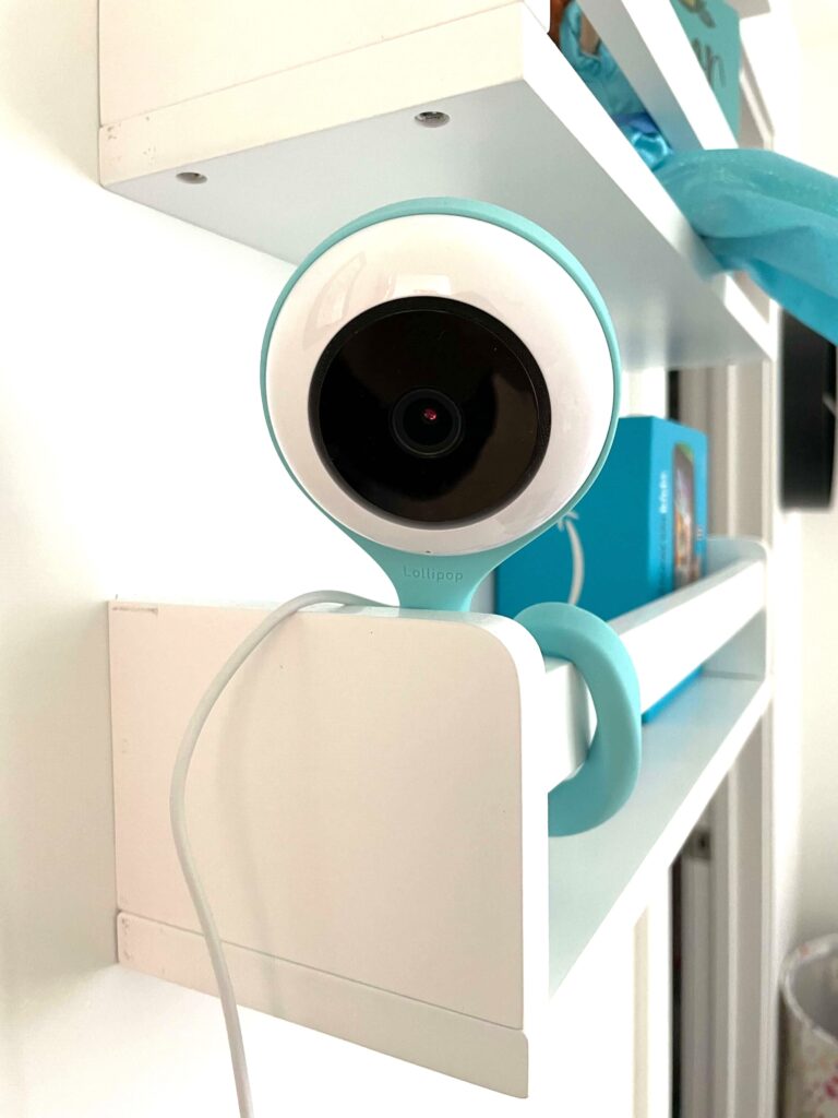 Image of the Lollipop baby monitor mounted on a bookshelf