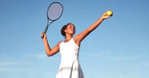 Photograph of woman playing tennis