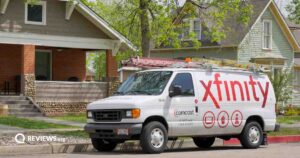 An Xfinity van parked in front of a house.