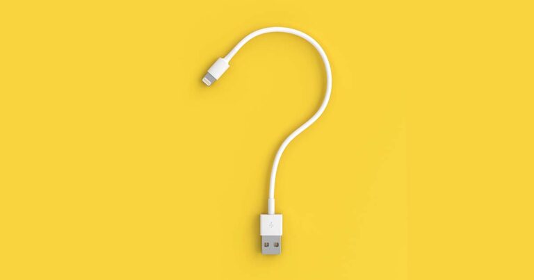 Lighting phone charger shaped like a question mark on a yellow background