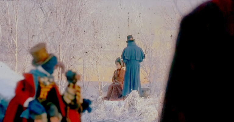 A screenshot from "When Love is Gone, The Muppets Christmas Carol" depicting Scrooge, Belle and Gonzo