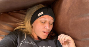 Girl 'sleeping' with the SleepPhones wireless on