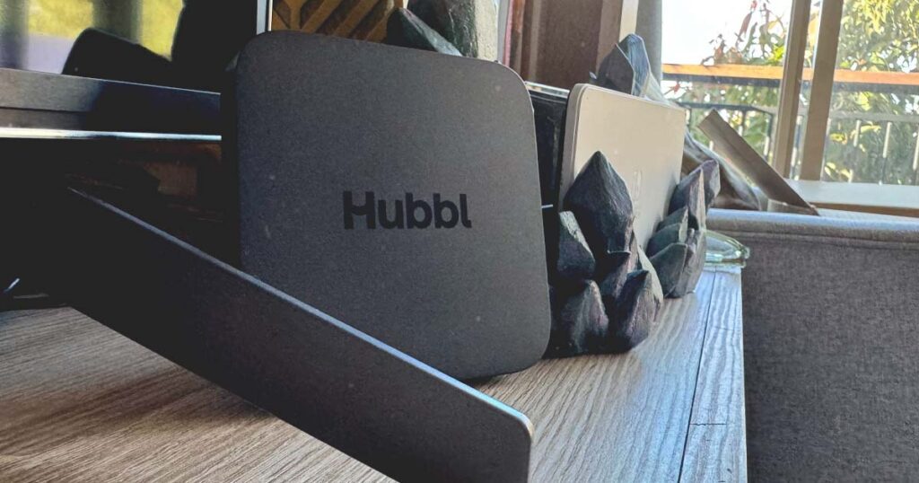 Photograph of the Hubbl Box on its side next to a Nintendo Switch dock, standing roughly at the same height.
