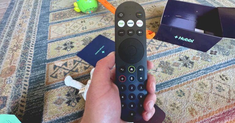 Photograph of someone holding the Hubbl remote