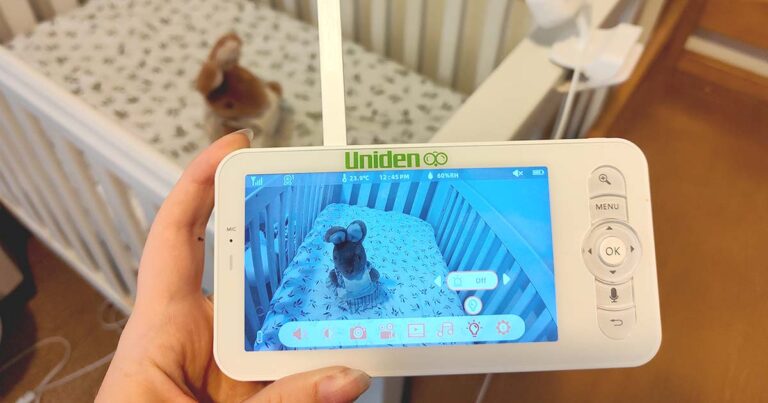 Photograph of somone using the monitor for the Uniden Baby Watch Smart Baby Video Camera/Monitor (BW6101R)