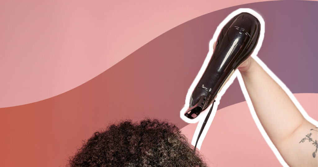 hair dryer drying curly hair on a pink background