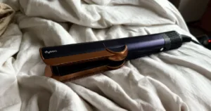 dyson airstrait on linen bedding