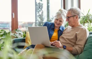 Senior couple looking at a laptop together