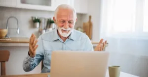 Man excited about the news and offers he has discovered on his computer