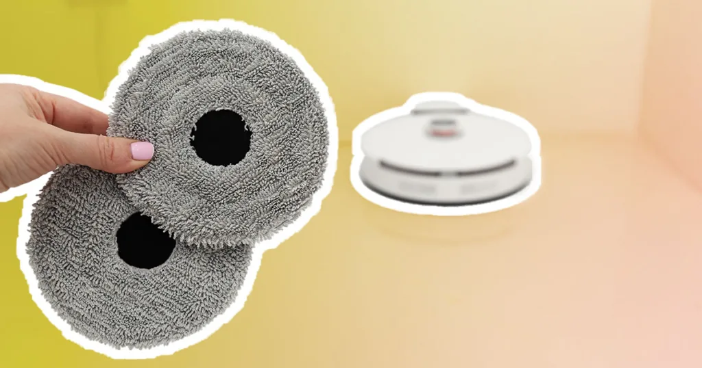 robot vacuum cleaner mop heads in the foreground with a robovac in the background. A transparent yellow and orange gradient is filling the background space