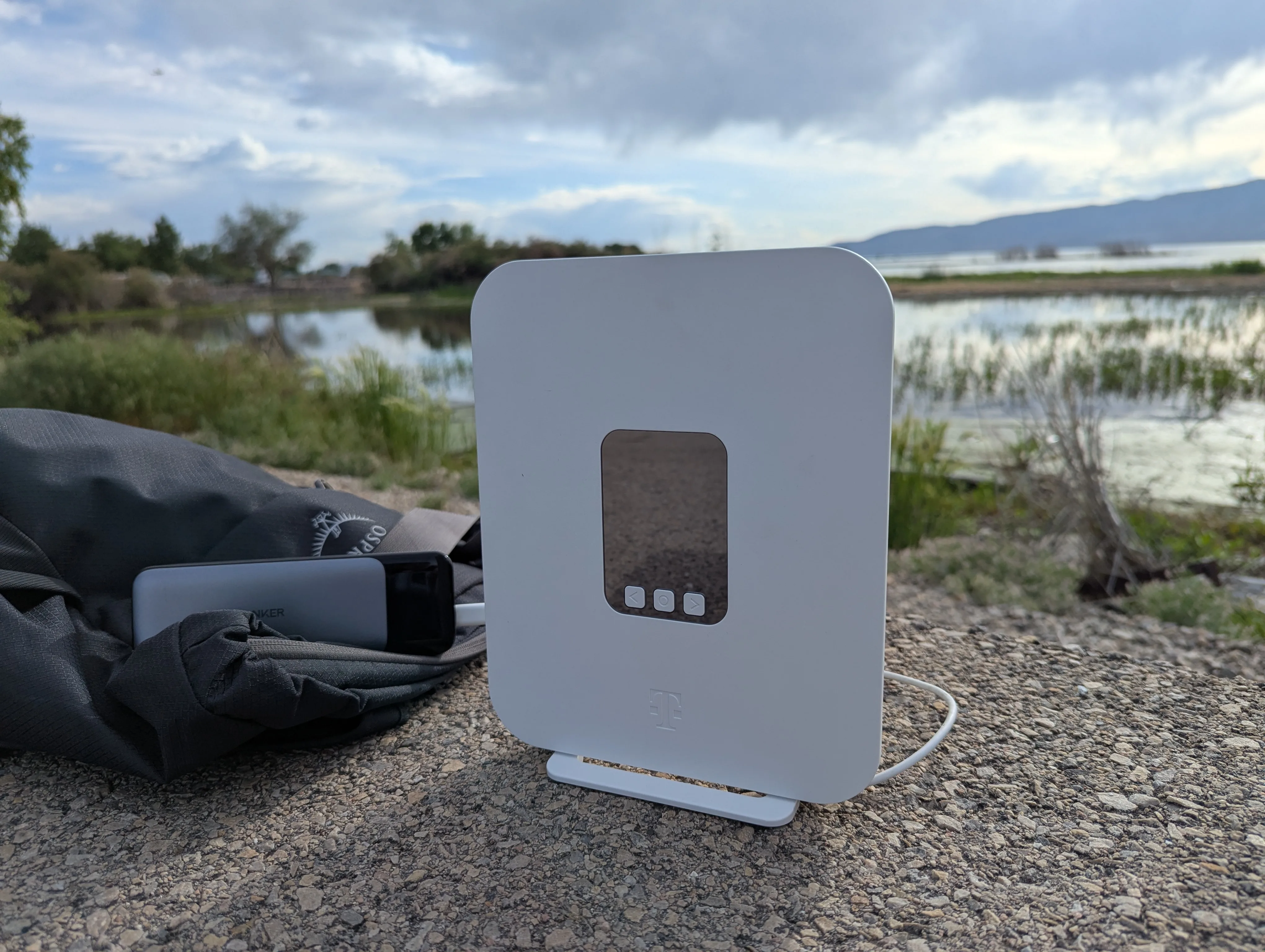 T-Mobile AWAY device set up on group with lake in the background