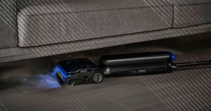 Tineco Steam One S9 Artist laying flat underneath a grey couch